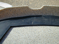 Hatch gasket and strap notch
