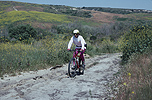 Don riding on a Carlsbad ranch road